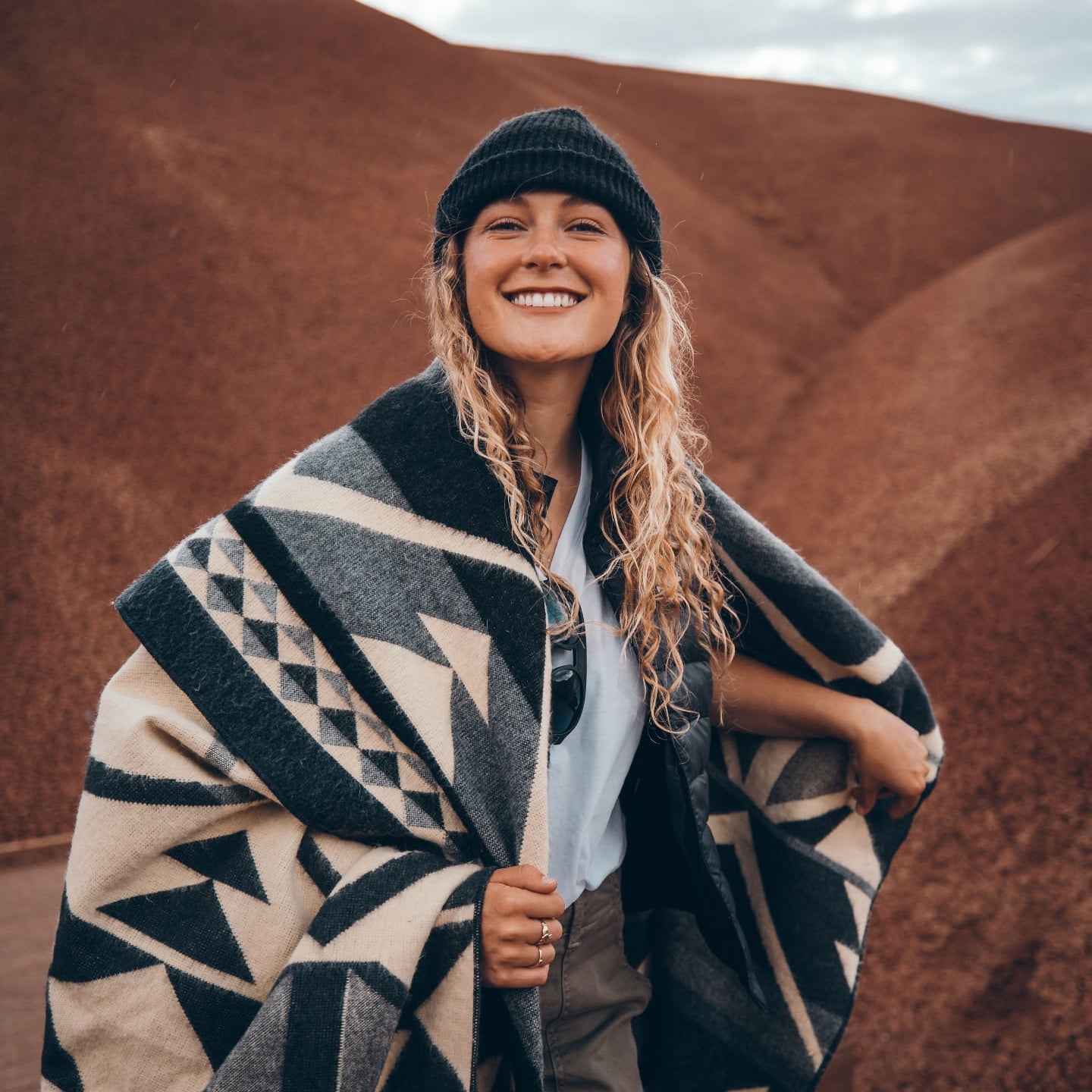 blond woman in blanket
