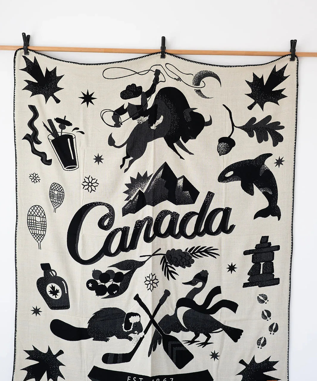 Canadian Symbols in blanket and white being displayed hanging