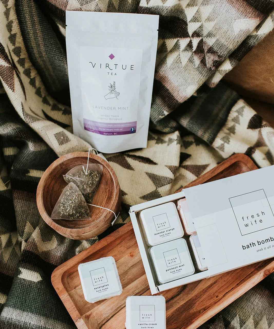 Lavender mint tea, bath bombs, and tea bags on a cozy patterned blanket