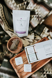 Lavender mint tea, bath bombs, and tea bags on a cozy patterned blanket