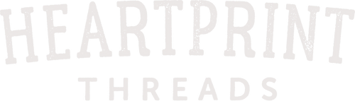 Distressed white text logo reading 'Heartprint Threads' on transparent background