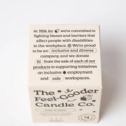 Feel-Gooder Candle Co. box packaging highlighting inclusive employment and donation pledge.