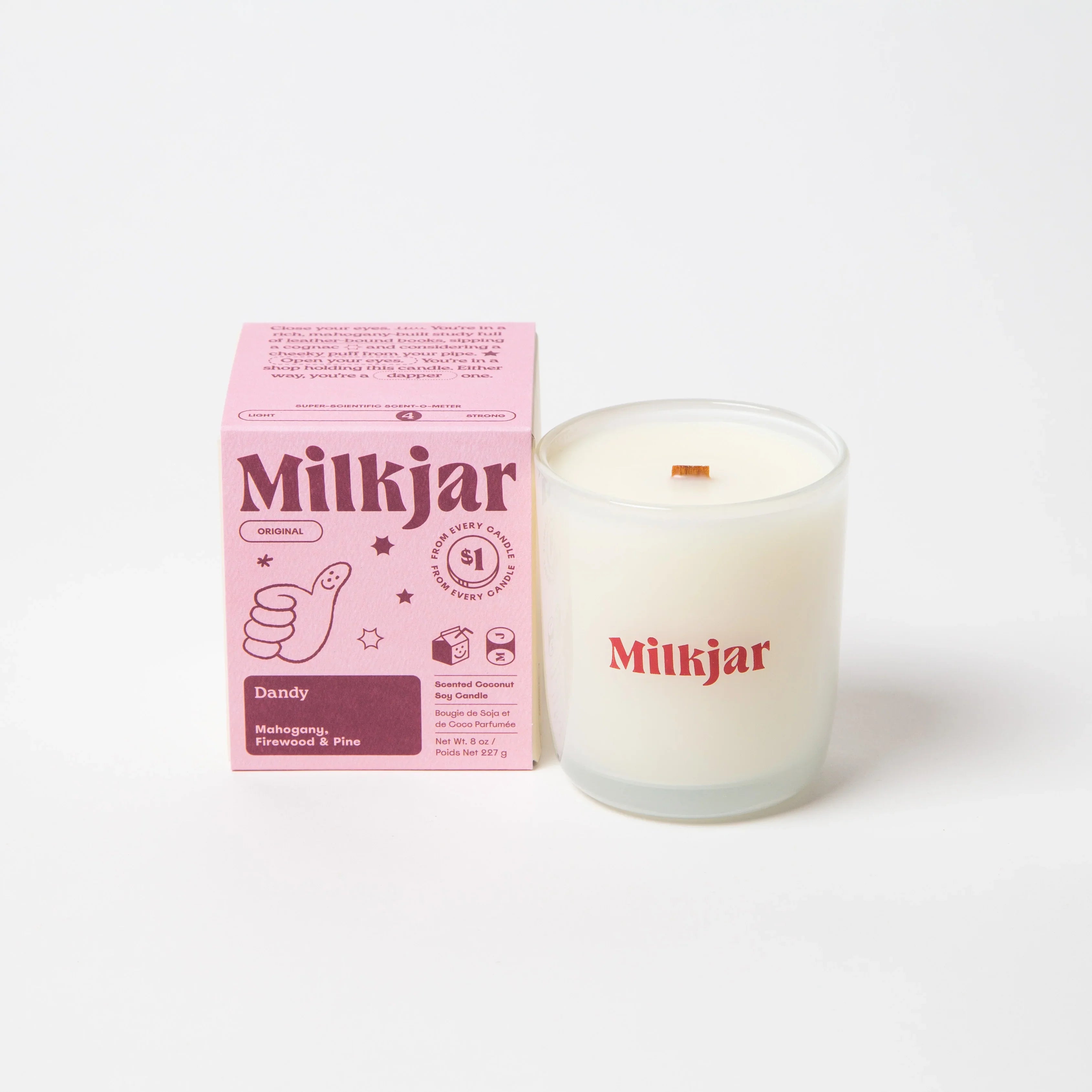 Milkjar Dandy scented coconut soy candle with pink packaging, mahogany firewood pine