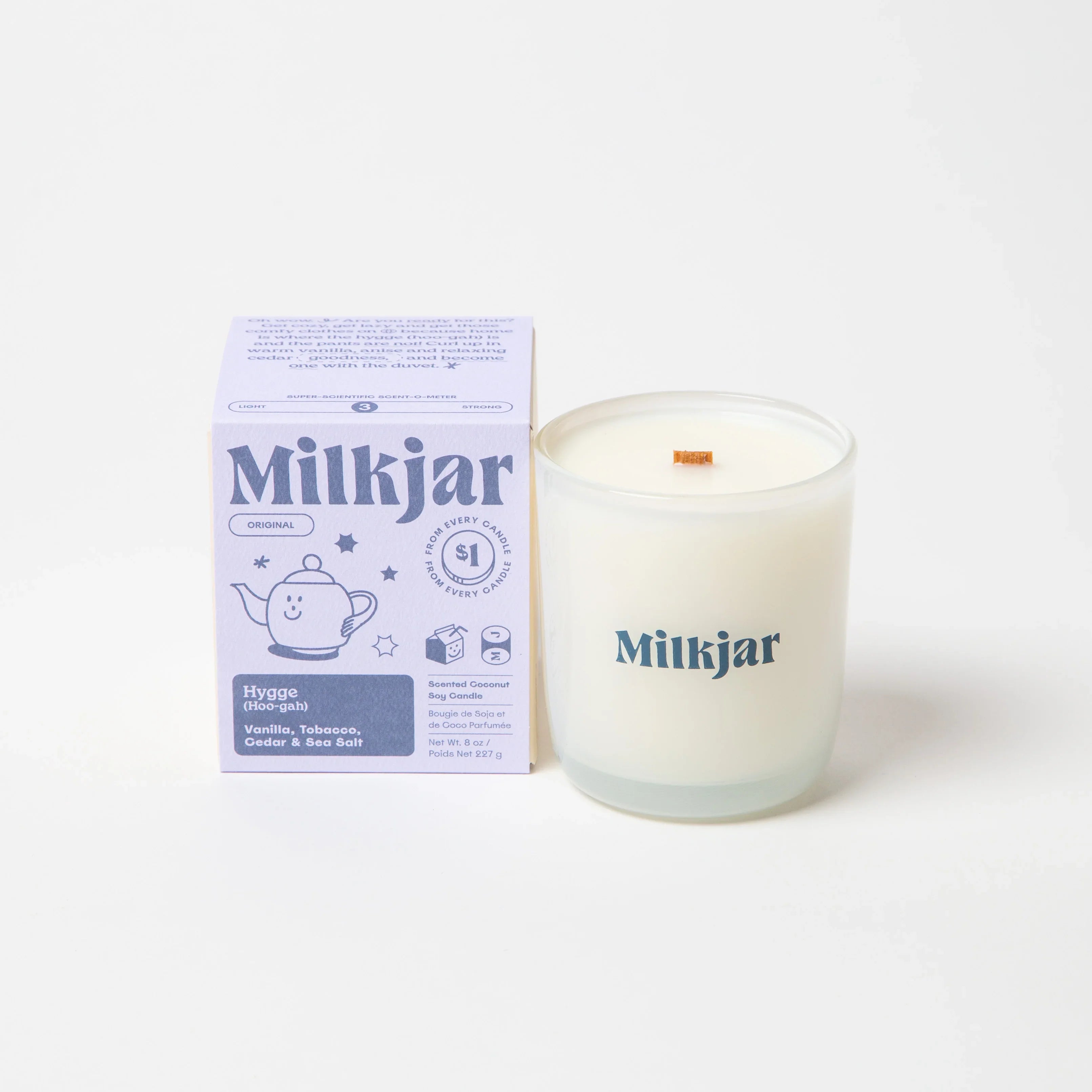 Milkjar Hygge scented coconut soy candle with vanilla, tobacco, cedar, and sea salt.