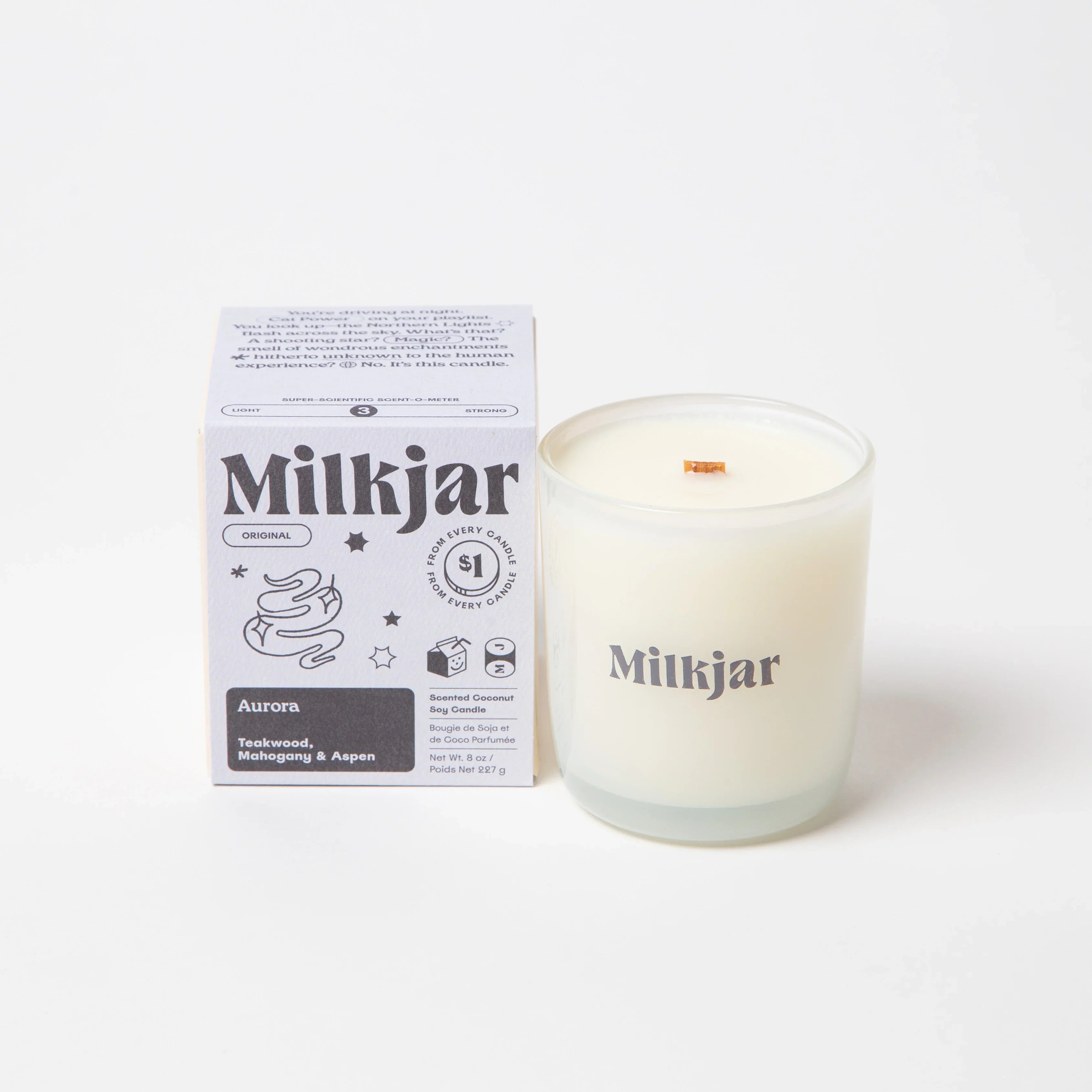 Milkjar Aurora scented coconut soy candle with box, teakwood, mahogany, aspen notes